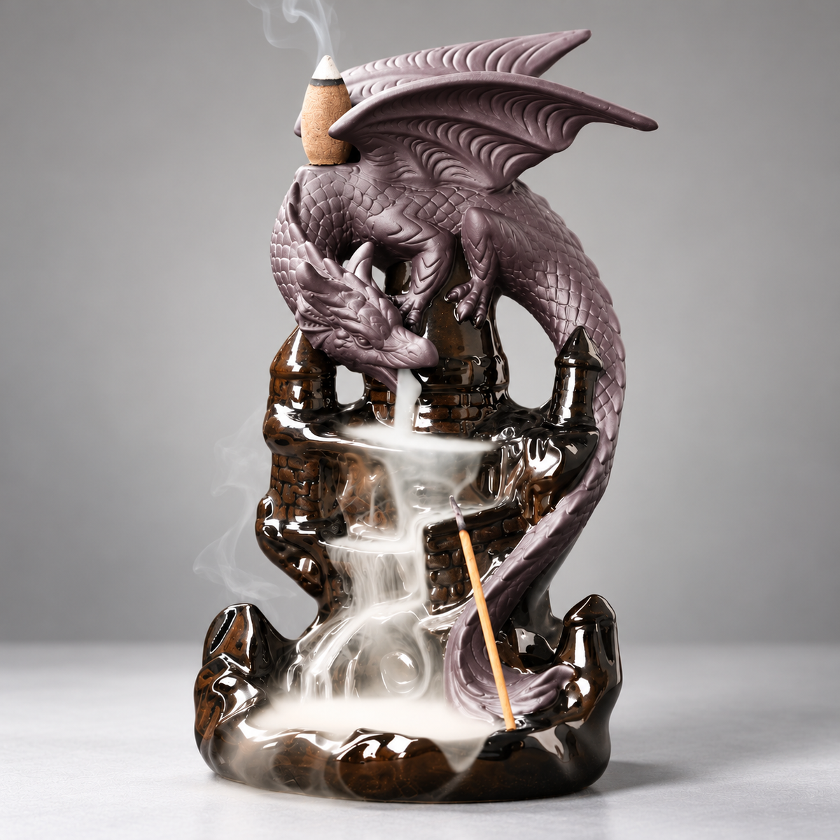Dark dragon tower backflow incense burner on a neutral background
